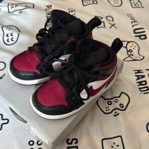 Kids Black and Red Nike Sneakers